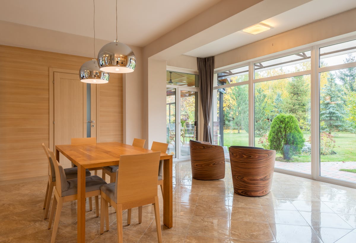 Restaurant dining area with large windows and heat rejection film