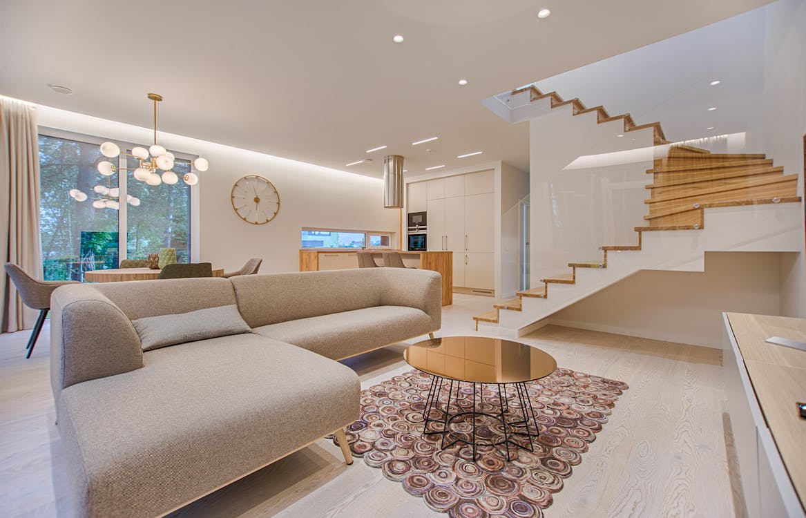 Elegant modern living room with large windows and natural light streaming in