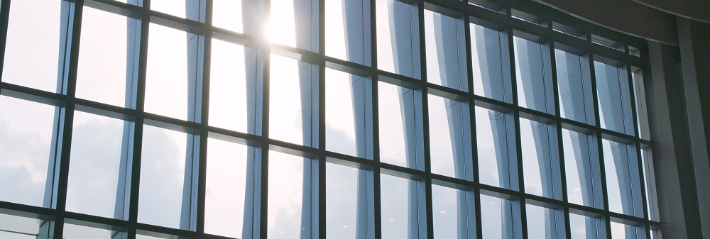 Airport window with sunlight flare